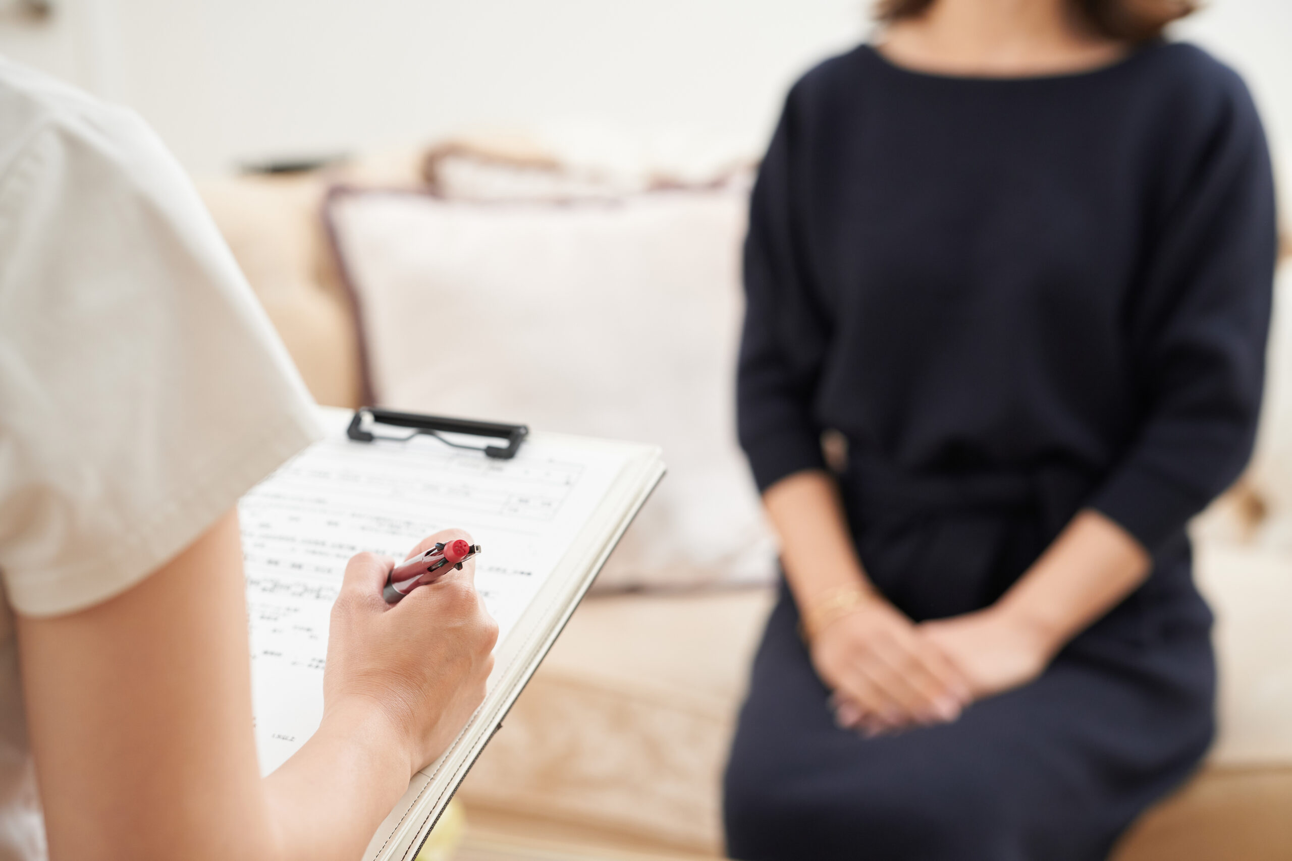 Woman receiving a consultation from a staff member