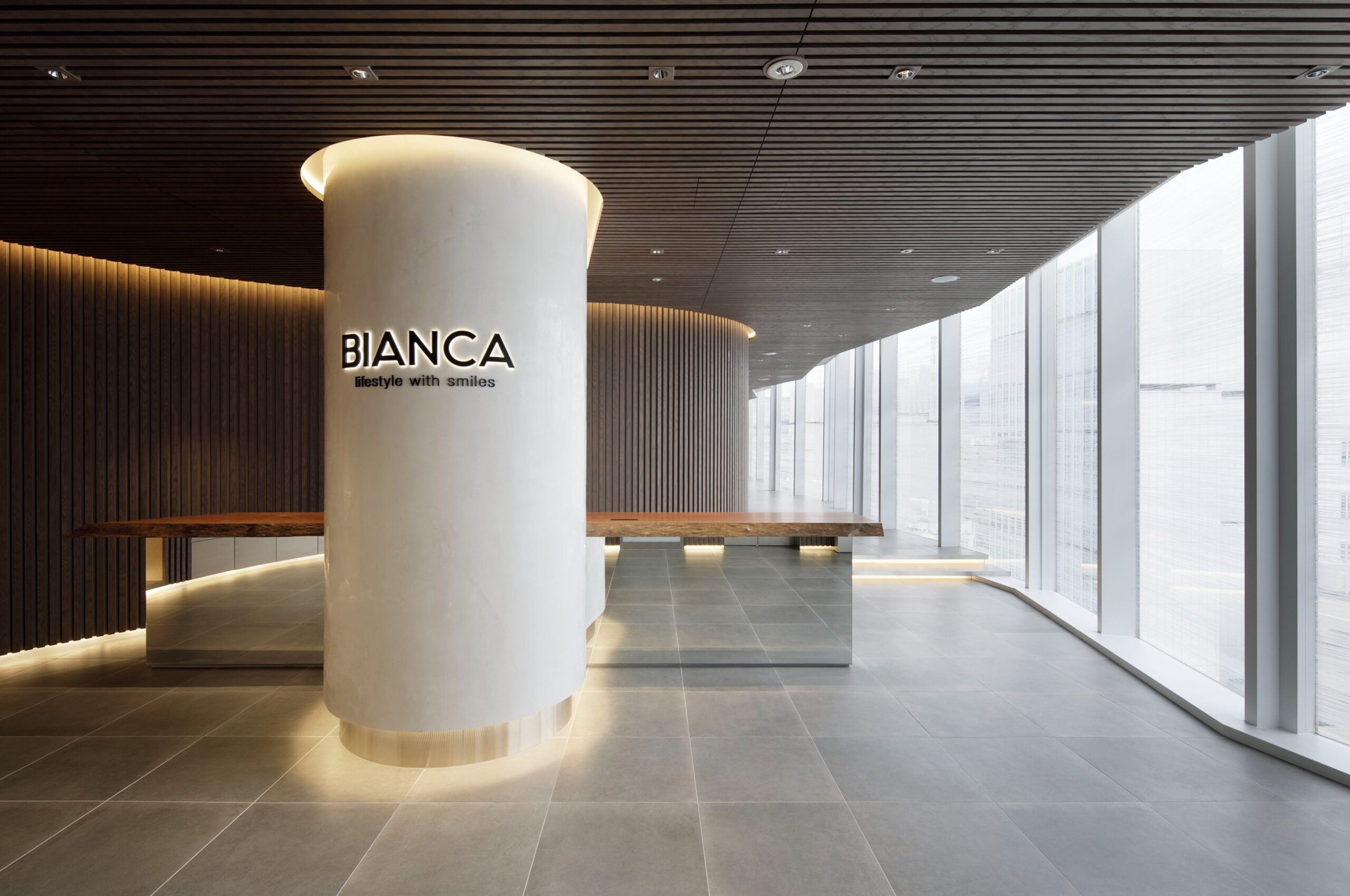 BIANCA CLINIC entrance with marble-style pillar and open windows