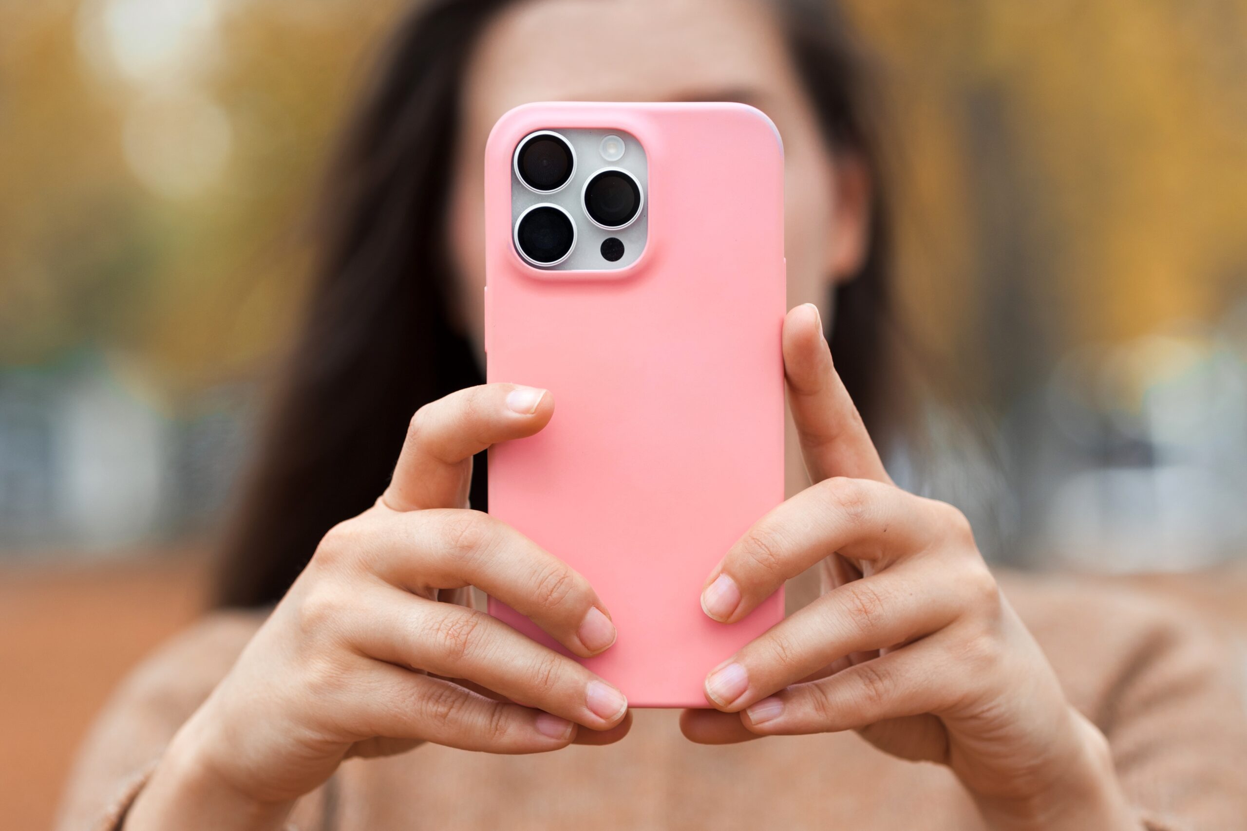 A person researching cosmetic clinics on a smartphone