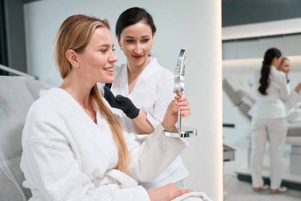 A woman receiving a consultation at a cosmetic clinic