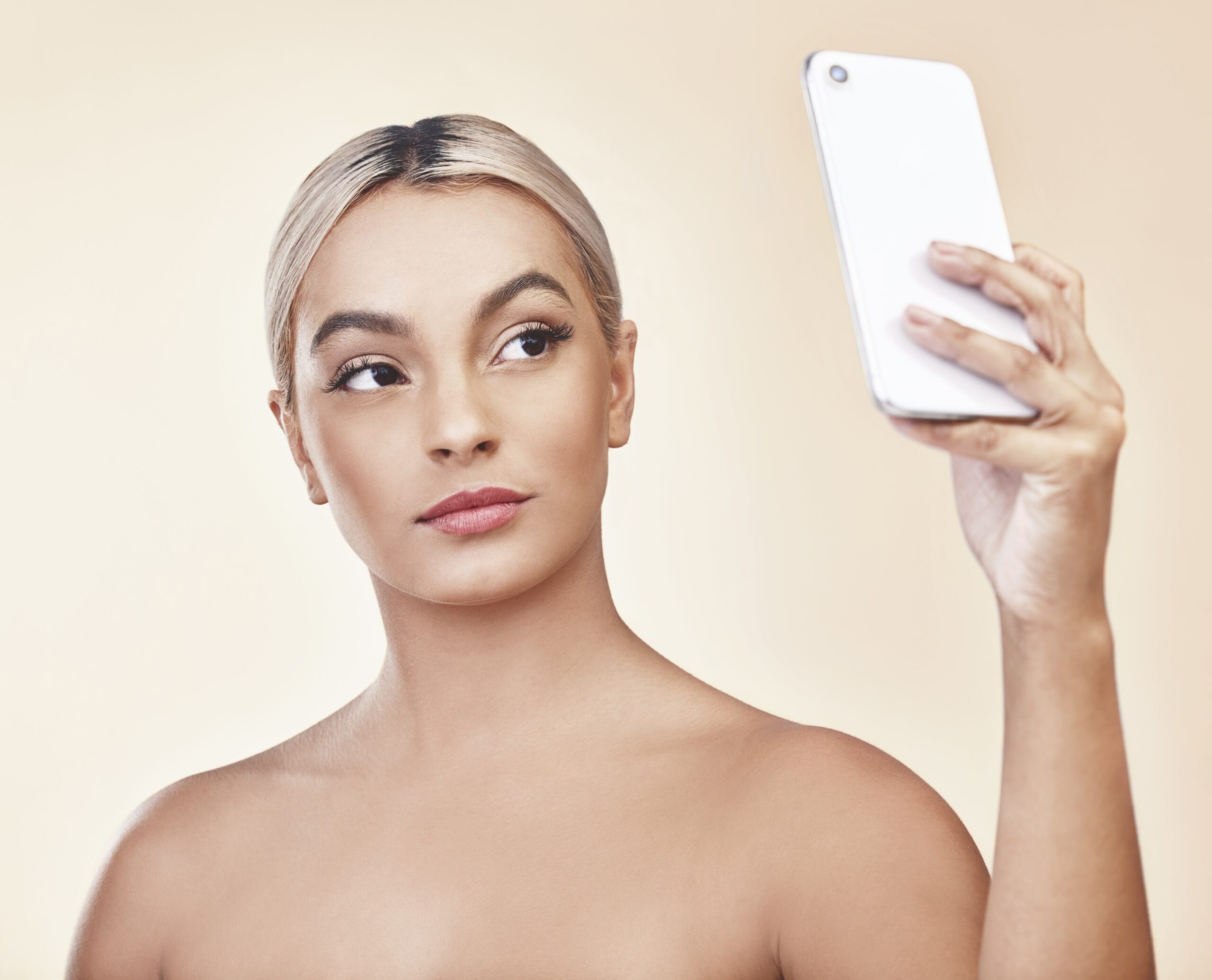 Woman taking a selfie scaled