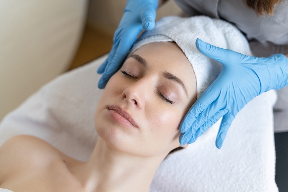 A woman receiving a cosmetic treatment